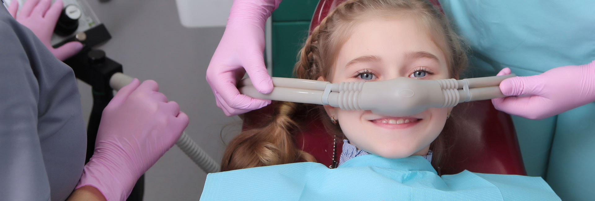 A little girl is comfortable to treat her teeth under superficial sedation.